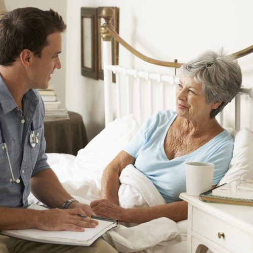 doctor-talking-with-senior-patient-in-bed